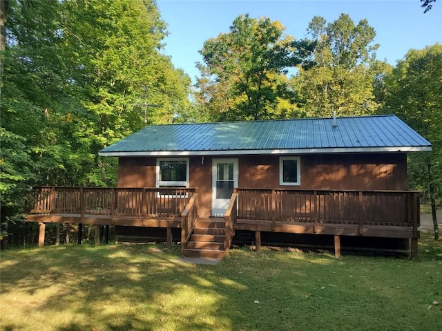 view of front of house with a front lawn and a wooden deck