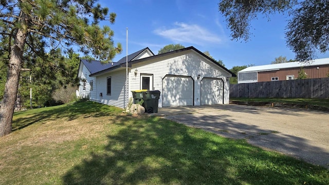 ranch-style home with a front lawn and a garage