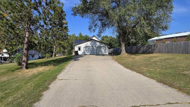 view of front facade with a front yard and a garage