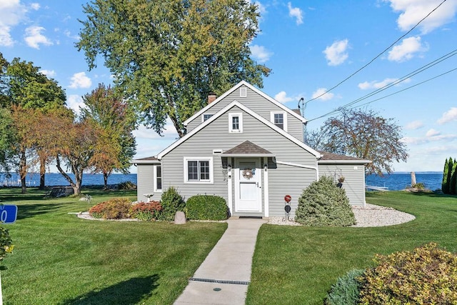 3790 Pau Ko Tuk Ln, Oshkosh, WI 54902 - bungalow-style home featuring a front yard, a chimney, a water view, and roof with shingles