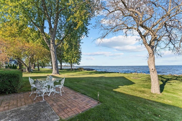 3790 Pau Ko Tuk Ln, Oshkosh, WI 54902 - view of grassy yard featuring a water view and a patio area