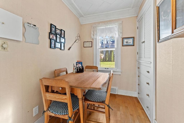 3790 Pau Ko Tuk Ln, Oshkosh, WI 54902 - dining space featuring crown molding and light wood-style flooring