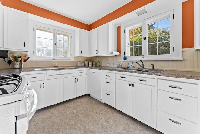 3790 Pau Ko Tuk Ln, Oshkosh, WI 54902 - kitchen featuring a sink, healthy amount of natural light, white cabinetry, and white range with electric cooktop