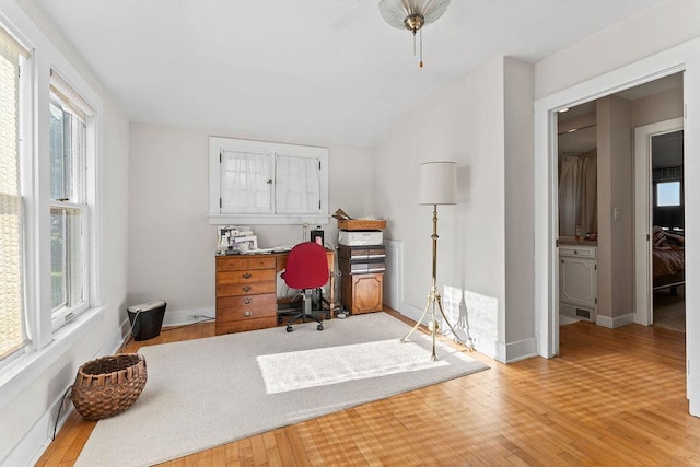 3790 Pau Ko Tuk Ln, Oshkosh, WI 54902 - home office with light wood-style floors, baseboards, and vaulted ceiling
