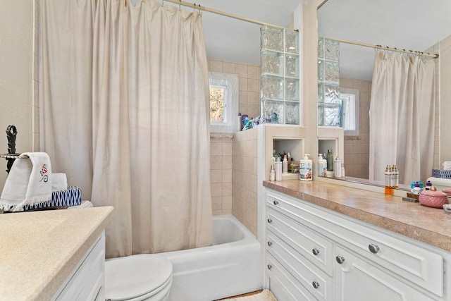 3790 Pau Ko Tuk Ln, Oshkosh, WI 54902 - bathroom featuring vanity, shower / bathtub combination with curtain, and toilet