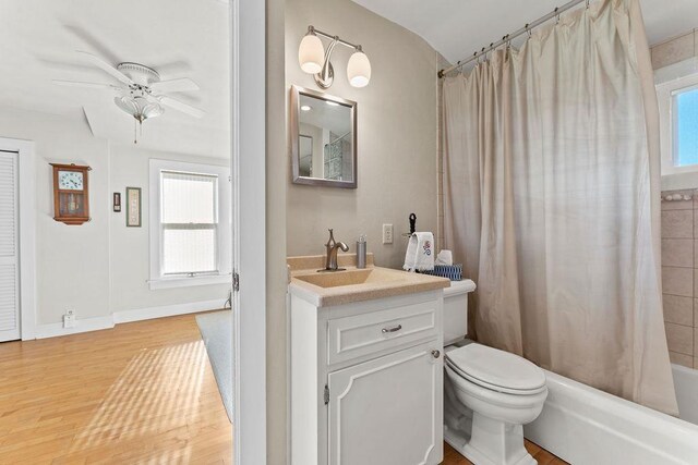 3790 Pau Ko Tuk Ln, Oshkosh, WI 54902 - bathroom featuring plenty of natural light, wood finished floors, ceiling fan, and shower / bath combo with shower curtain