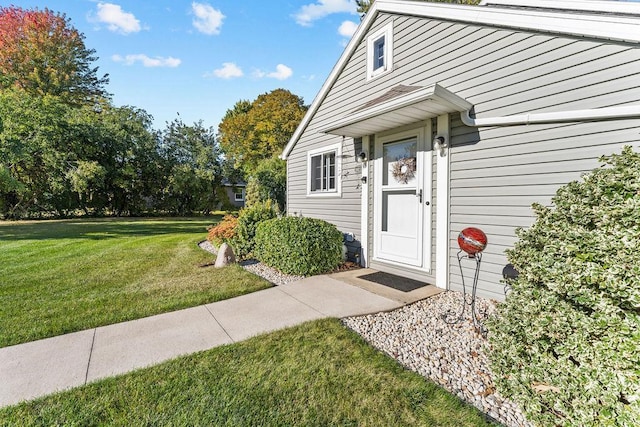 3790 Pau Ko Tuk Ln, Oshkosh, WI 54902 - view of exterior entry featuring a lawn