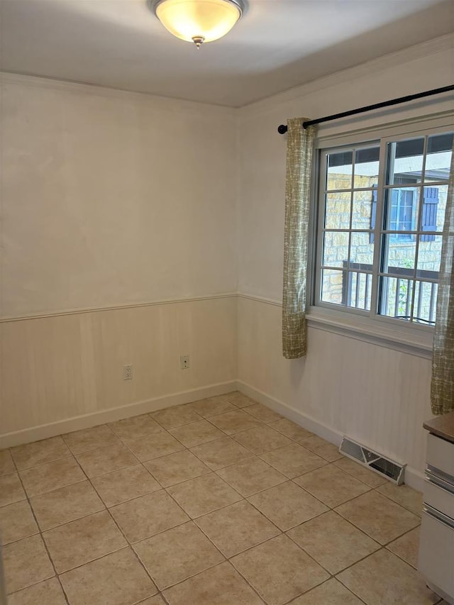 empty room with light tile patterned floors