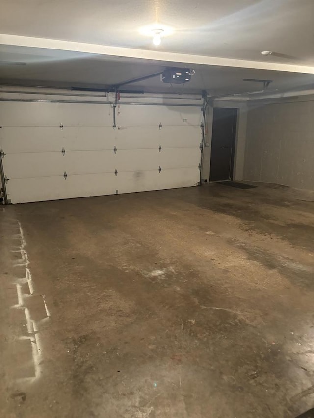 garage featuring a garage door opener