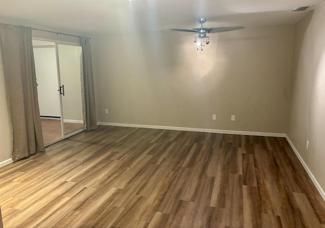 spare room with wood-type flooring and ceiling fan