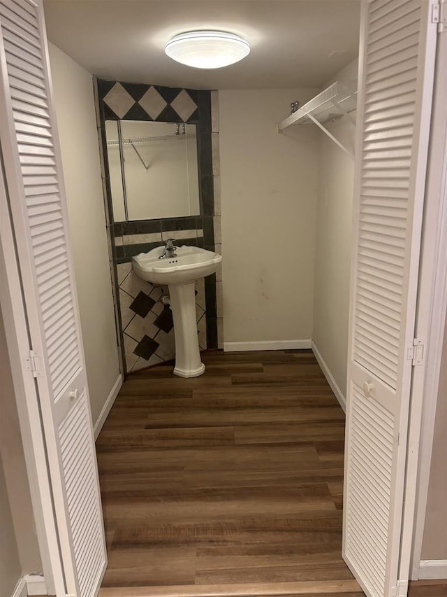 bathroom with sink and hardwood / wood-style floors