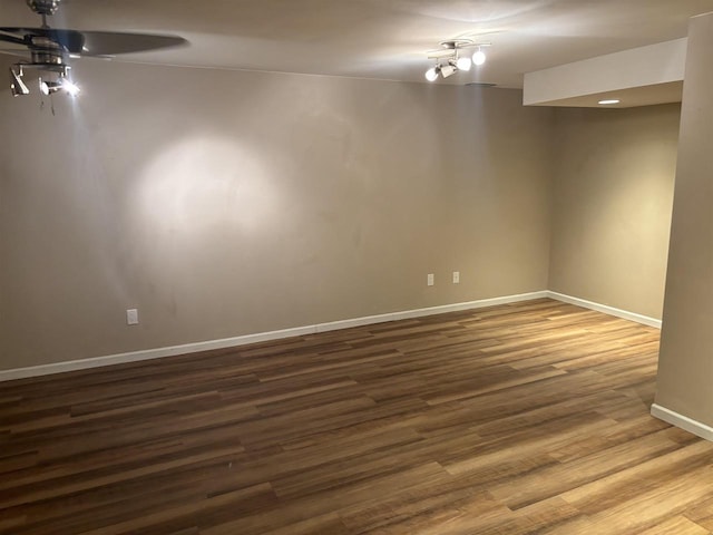 empty room with hardwood / wood-style flooring and ceiling fan