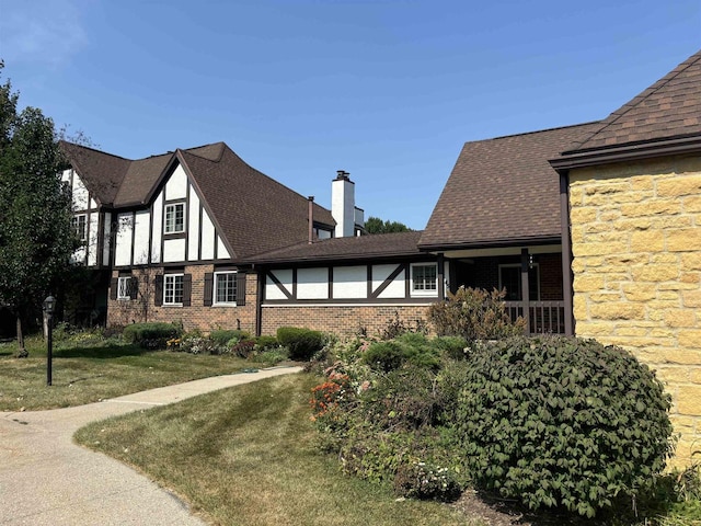 view of home's exterior with a lawn