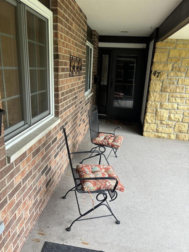 property entrance with covered porch