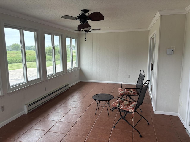 unfurnished sunroom featuring ceiling fan and baseboard heating