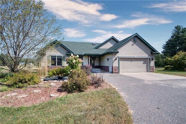 9018N Anderson Rd, Hayward, WI 54843 - ranch-style home with driveway, an attached garage, and brick siding