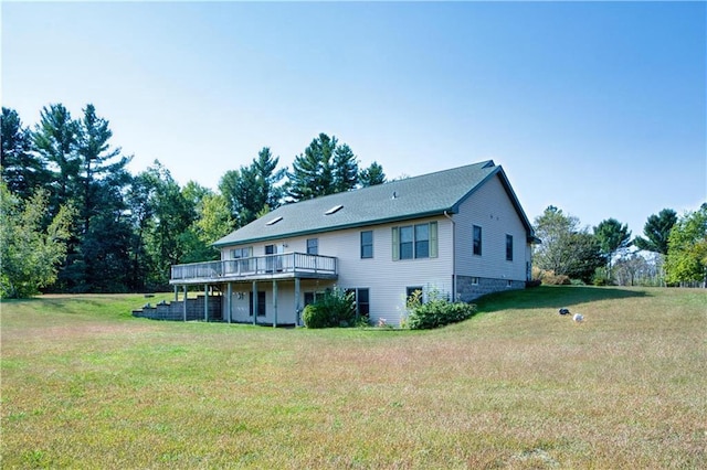 9018N Anderson Rd, Hayward, WI 54843 - back of house with a wooden deck and a lawn