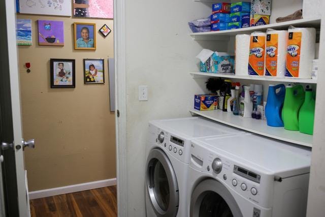 laundry area featuring washer and clothes dryer and dark hardwood / wood-style floors