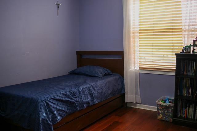 bedroom featuring dark hardwood / wood-style flooring