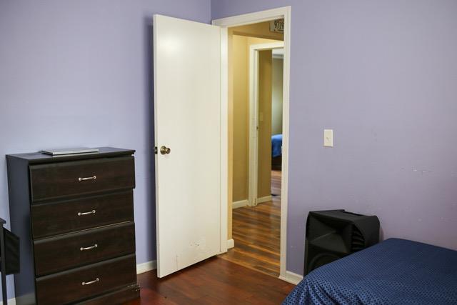 bedroom featuring dark hardwood / wood-style floors