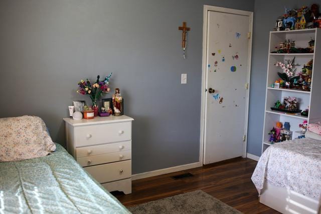 bedroom featuring dark wood-type flooring