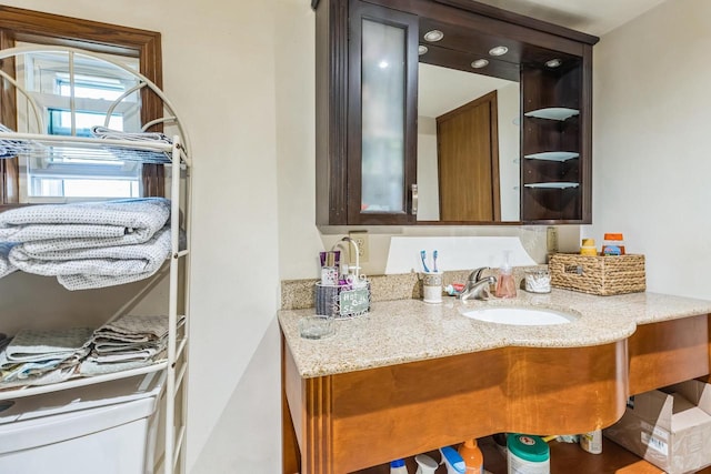 bathroom featuring vanity and toilet