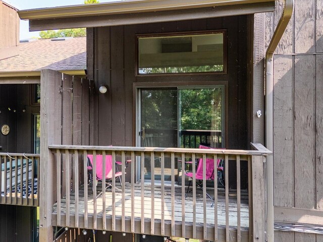 view of exterior entry featuring a deck