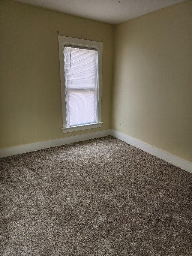 1646 Kane St, La Crosse, WI 54603 - empty room featuring baseboards and carpet flooring