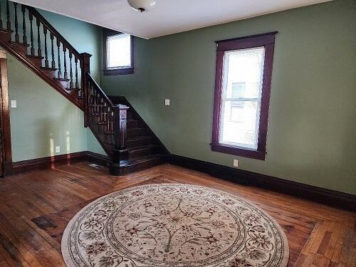 1646 Kane St, La Crosse, WI 54603 - staircase featuring baseboards and wood finished floors