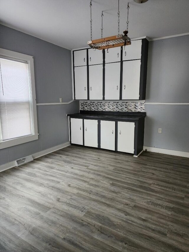 1646 Kane St, La Crosse, WI 54603 - interior space featuring visible vents, white cabinetry, baseboards, and dark wood-style flooring