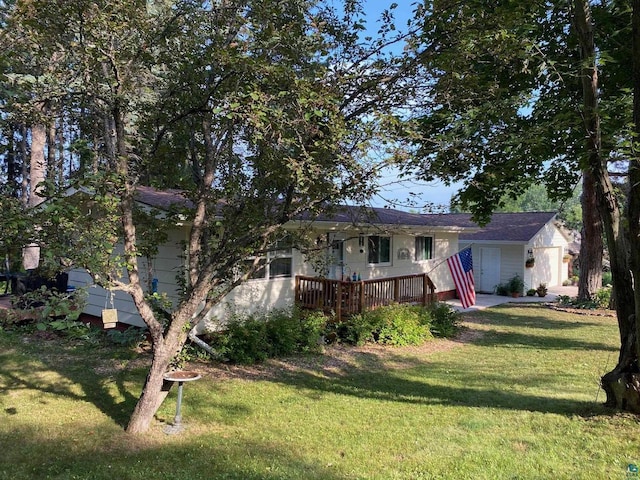 view of front of home featuring a front lawn and a wooden deck