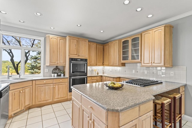 kitchen with appliances with stainless steel finishes, ornamental molding, light brown cabinets, and light tile patterned floors