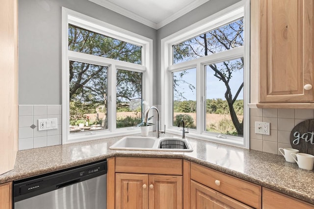 kitchen with sink, decorative backsplash, ornamental molding, stone countertops, and stainless steel dishwasher