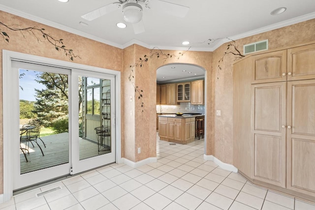 interior space with crown molding and ceiling fan