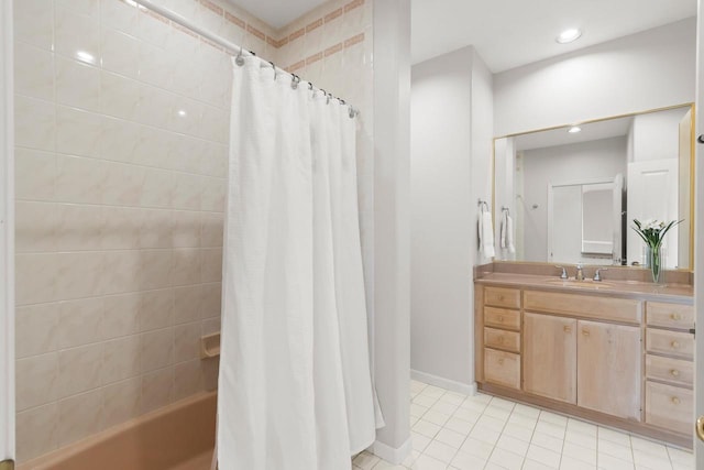 bathroom with shower / tub combo, tile patterned floors, and vanity