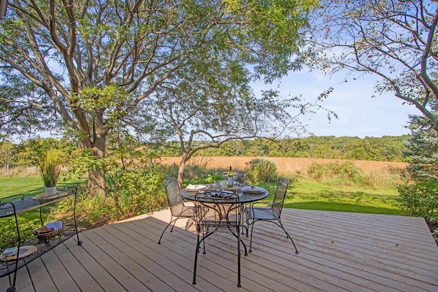 wooden deck with a lawn