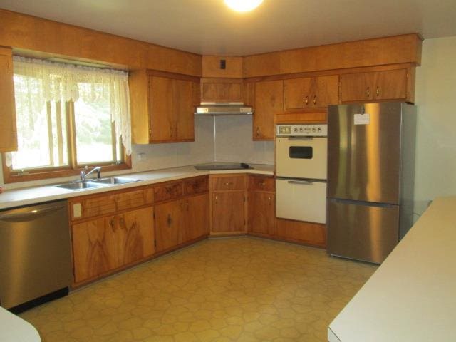 kitchen with appliances with stainless steel finishes and sink