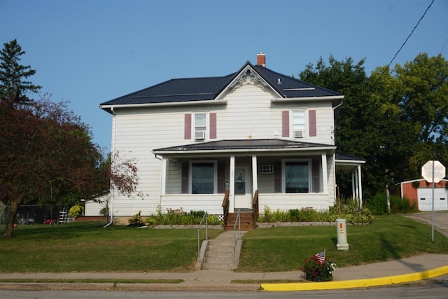 view of front facade featuring a front yard