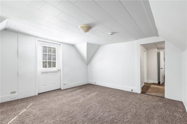 bonus room featuring carpet flooring and lofted ceiling