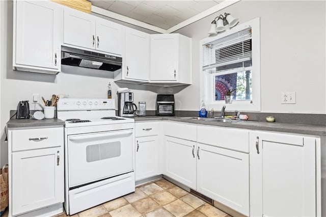 kitchen with white cabinetry, under cabinet range hood, electric stove, and dark countertops