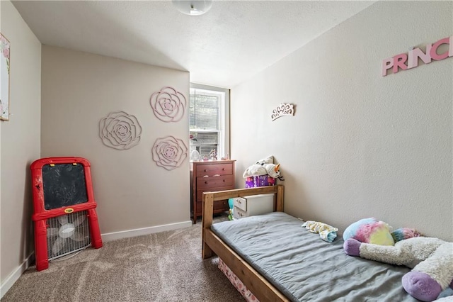 carpeted bedroom with baseboards