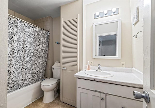 full bathroom featuring shower / bath combination with curtain, tile patterned floors, vanity, and toilet