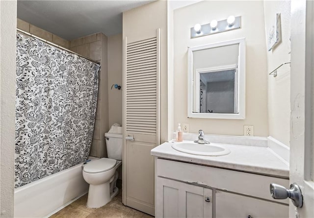 bathroom featuring toilet, shower / bath combo with shower curtain, tile patterned flooring, and vanity