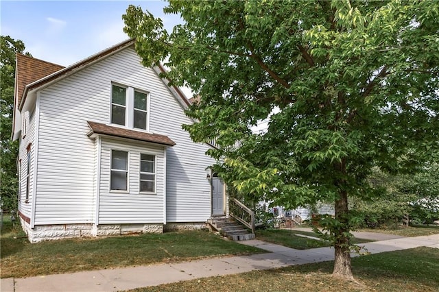 view of front of house with a front yard and entry steps