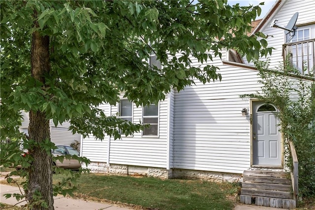 view of side of property with entry steps