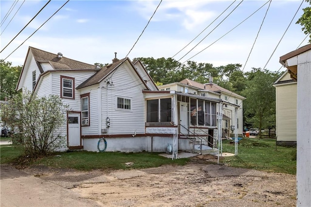 back of property featuring a sunroom