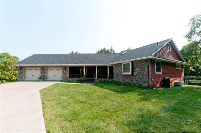 ranch-style house with a garage and a front lawn