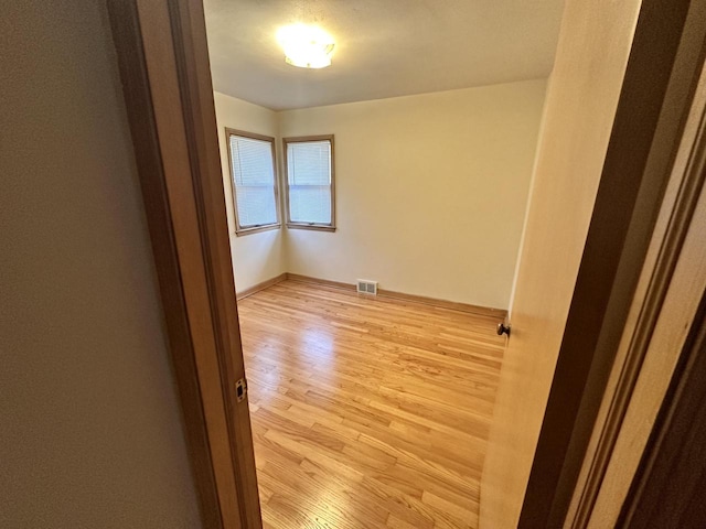 unfurnished room featuring light wood-type flooring