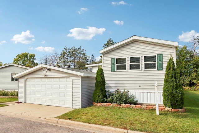 view of front of property with an outdoor structure, a front yard, and a garage