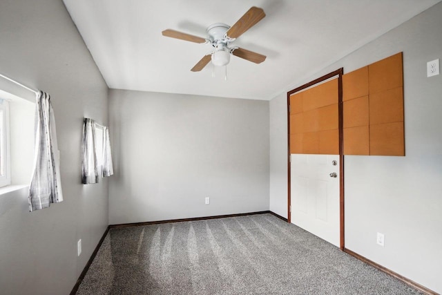 unfurnished bedroom with ceiling fan, a closet, and carpet